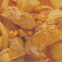 Massaman Curry · Spicy.  

Massaman curry with potatoes, white onions, and peanuts in coconut milk. Served wi...