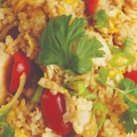 Thai Fried Rice · Stir-fried protein with jasmine rice, eggs, onions, and tomatoes, topped with cilantro and a...
