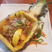 St13. Pineapple Fried Rice · Sauteed protein with rice, eggs, pineapple, tomatoes, white and green onions, cilantro, and ...