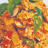 St11. Red Curry Fried Rice · Sauteed protein and jasmine rice in red curry with bamboo shoots, mushrooms, Thai basil, and...
