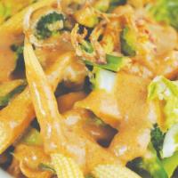 Pra Ram Long Song · Sauteed protein with broccoli, Asian greens, baby corn, and peanut sauce. Served with Jasmin...