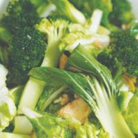 Pad Pak · Sauteed protein with Asian greens, broccoli, and baby corn in light brown sauce. Served with...