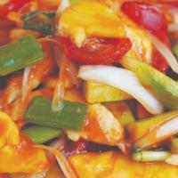 Pad Prew Wan · Sauteed protein with pineapples, onions, tomatoes, peppers, and cucumbers in Thai sweet and ...