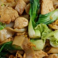 Pad See Eiw · Flat rice noodles stir-fried in brown sauce with eggs, broccoli, Asian greens, and a lime we...