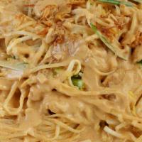 Thai Peanut Sauce Noodles · Thin rice noodles stir-fried in peanut sauce with eggs, bean sprouts, chives, and a lime wed...