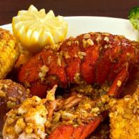 Lobster Tail · Served with corn and potatoes. Option to add more items