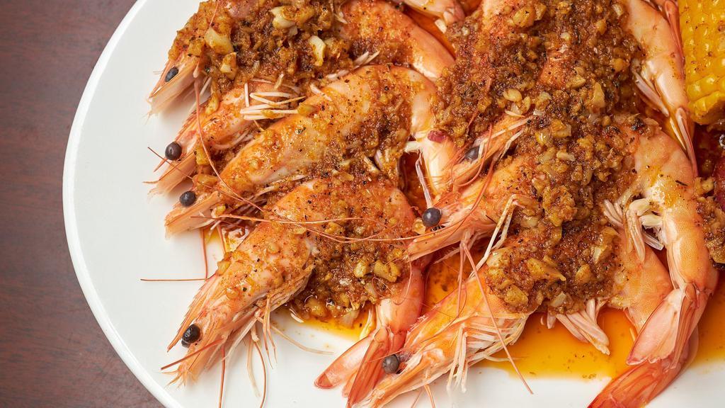 Small Catch Shrimp (Head On) · 0.5 lb fresh shrimp (head on) tossed in flavorful seasoning and spice of choice. Served with corn and potatoes. Option to add more items