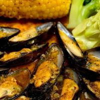 Large Catch Black Mussels · 1 lb fresh black mussels tossed in flavorful seasoning and spice of choice. Served with corn...