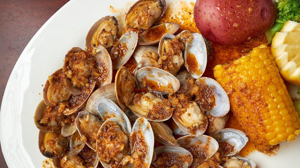 Small Catch Clam · 0.5 lb fresh clams tossed in flavorful seasoning and spice of choice. Served with corn and potatoes. Option to add more items