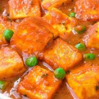 Mutter Paneer · Green peas cooked with homemade cottage cheese in a light sauce.

Item does not include naan...
