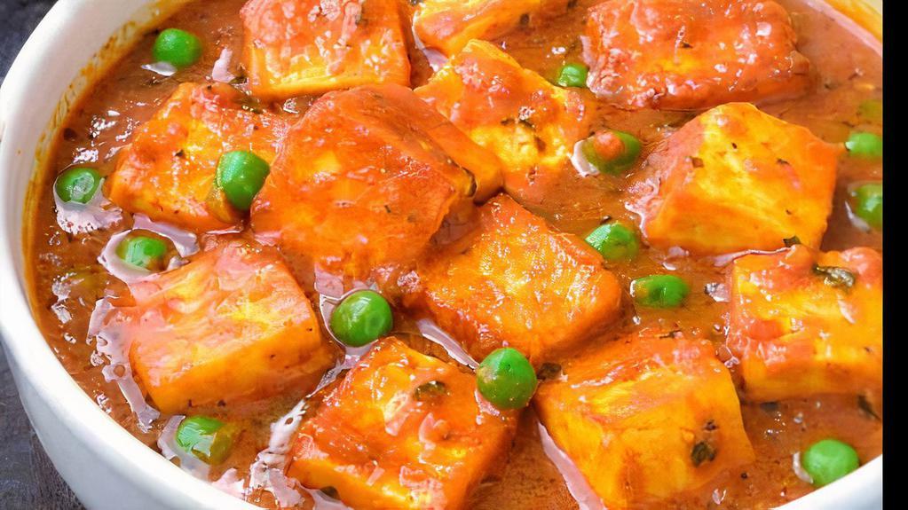 Mutter Paneer · Green peas cooked with homemade cottage cheese in a light sauce.

Item does not include naan or rice please order separately.