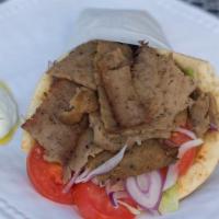 Krave Gyro · Your choice of meat stuffed in a warm pita, lettuce, tomato, red onion, and tzatziki.