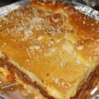 Yia Yia'S Pastichio · Luscious layers of seasoned ground beef, Greek noodles, and a creamy bechamel sauce baked to...