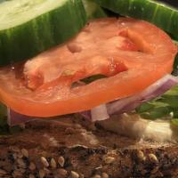 The Jerusalem · Fresh Hummus, Tomato, Red Onions, Cucumber & Arugula