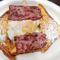 French Toast · Four triangular pieces of french toast. Served with syrup and butter.