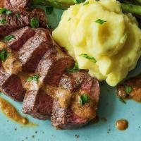 14 Oz Certified Grass-Fed New York Strip · Served with mashed potatoes, market vegetables, peppercorn sauce.
