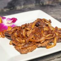 Bistec Encebollado · 12 oz Steak marinated in onions and fresh peppers served with your choice of side.