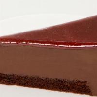 Framboise Au Chocolat · Dense chocolate mousse atop a thin layer of raspberry compote and chocolate sponge. Finished...