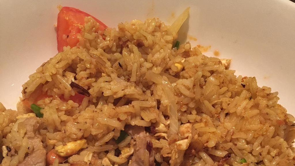 Pineapple Fried Rice · Pineapple, egg, tomato, onion, curry spice and cashew nut.