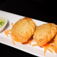 Curry Puff · Puff pastry filled with chicken, potato and curry spice.