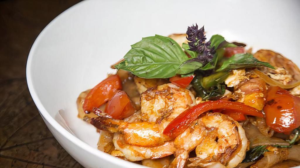Drunken Noodles · Spicy wide rice noodles chili, basil, egg, onion and tomato.