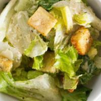 Caesar Salad · romaine lettuce, romano cheese, shaved parmesan, roasted garlic croutons and homemade caesar...