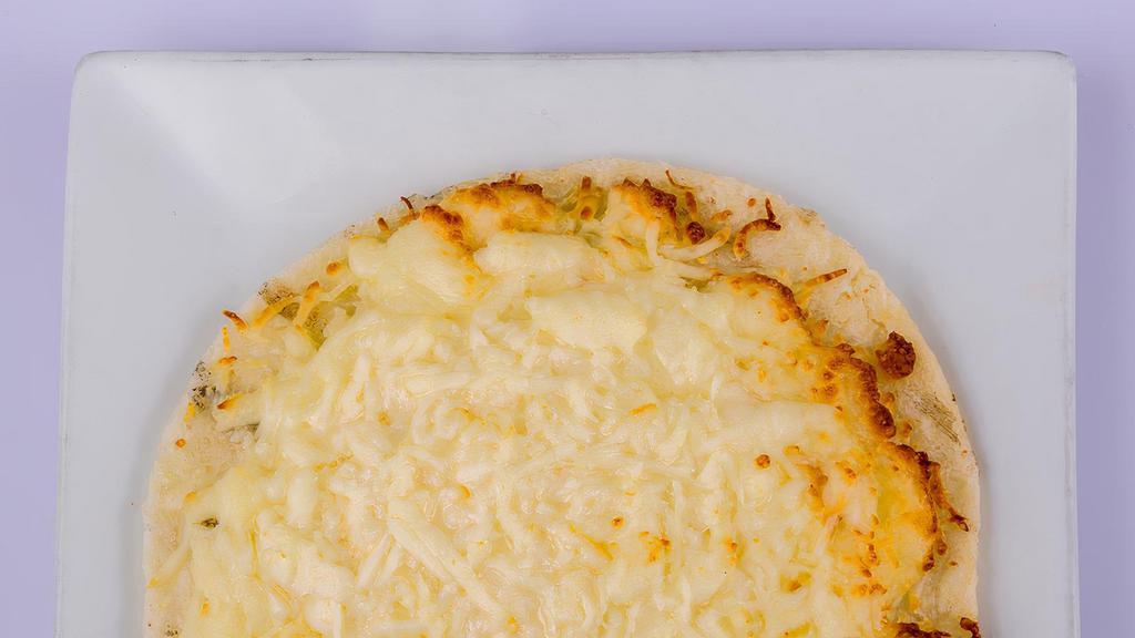 Arepa Con Queso · Arepa with melted cheese.