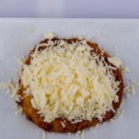 Arepa De Chocolo Con Queso · Sweet arepa with melted cheese.