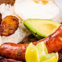 Bandeja Paisa · This traditional Colombian dish is packed with flavor, Bandeja Paisa features rice, beans, b...