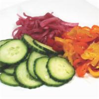House Pickles
 · Cucumber + red onions.