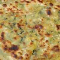 Mooli Paratha
 · Wheat flat bread filled with spices and reddish (layered and shallow fried).
