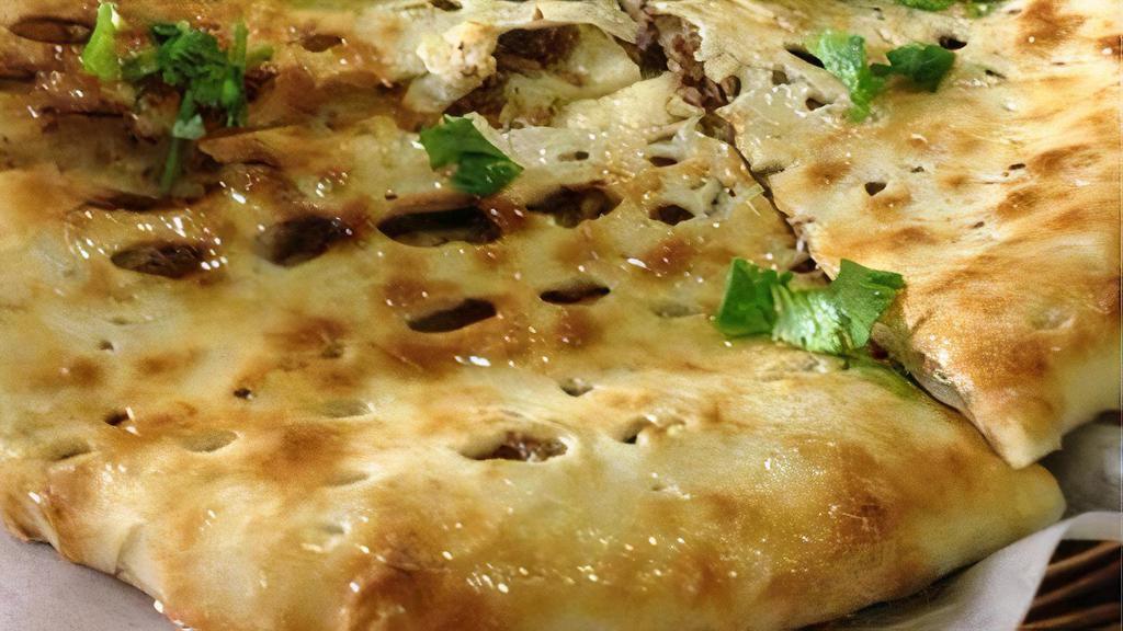 Keema Paratha
 · Wheat flat bread filled with spices and minced chicken (layered and shallow fried).