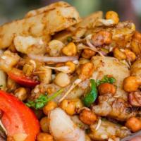 Chana Chaat
 · White chickpeas with blend of chutneys and onions and green peppers.