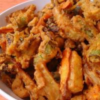 Vegi Pakora  · Appetizing vegetable fritters.
(half pound)