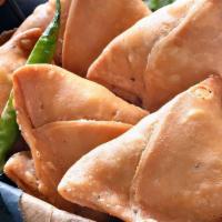 2 Vegetable Samosa  · Triangular patties filled with Cumin flavored potatoes and peas wrapped in a flaky pastry. S...