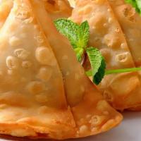 Two Keema Samosa   · Triangular patties filled with mince meat.