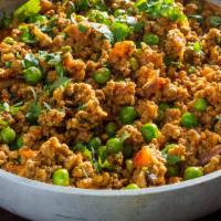 Keema Matar
 · Minced ground chicken meat with green peas. served with white sauce.