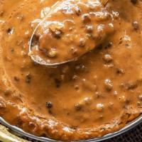 Dal Makhani (Lentil W/ Butter)  · Black lentils and kidney beans slowly simmered together with tomatoes, onion, ginger, and ga...