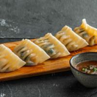 Chicken & Cabbage Dumplings . · Chicken dumplings (5pcs).
Served with sweet soy dipping sauce.
Contains: Gluten, Soy