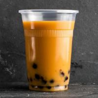 Mango Earl Grey Milk Bubble Tea · Mango earl grey milk tea with tapioca pearls. Made with oat milk.