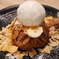 Milky Puff · warm puff pastry, brûlée bananas, white chocolate honey comb, corn flakes, served with conde...