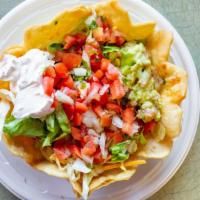 Tostada Salad · Large shell bowl filled with rice, beans, chicken or steak, lettuce, guacamole, pico de gall...