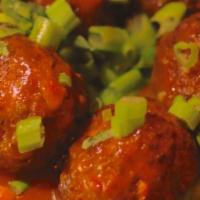 Veg Manchurian Appetizer · Ground mix vegetables rounds cooked in a tangy sauce.