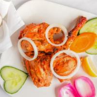 Tandoori Chicken · Half chicken marinated with yogurt and spices. The tastiest way to barbeque chicken. Served ...