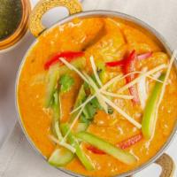 Chicken Tikka Masala · Chicken pieces roasted in a clay oven and tossed in a creamy tomato sauce, cooked with onion...