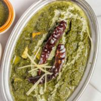 Palak Paneer · Homemade cottage cheese cooked together with spinach. Served with basmati rice pulao.