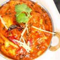 Kadai Paneer
 · A semi-dry and colorful preparation of homemade cottage cheese cooked in a wok with bell pep...