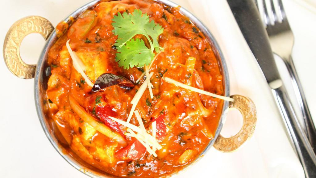 Kadai Paneer
 · A semi-dry and colorful preparation of homemade cottage cheese cooked in a wok with bell peppers, onions, and diced tomatoes. Served with basmati rice pulao.