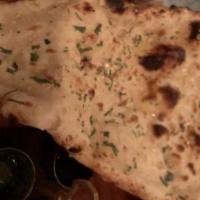 Garlic Naan · A bread made of white flour topped with fresh minced garlic.