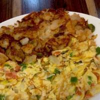 Huevos Pericos · Scrambled eggs with tomato, green peppers, onions, and jalapenos.